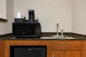 a kitchen with a microwave and a sink