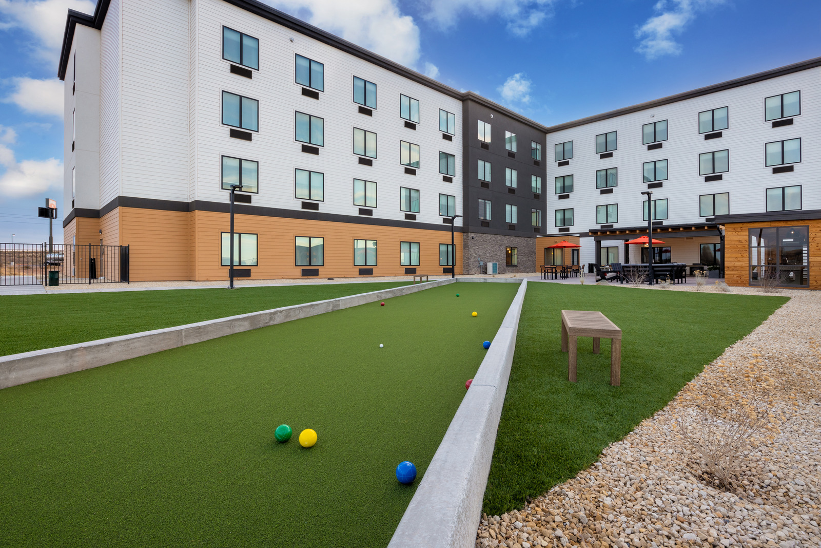 a hotel with a miniature golf course in front of it