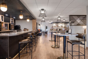 a bar with a bunch of stools around it