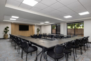 a conference room with a long table and chairs