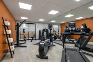 a gym with a variety of exercise equipment