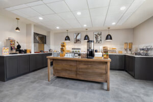 a kitchen with a counter and some lights