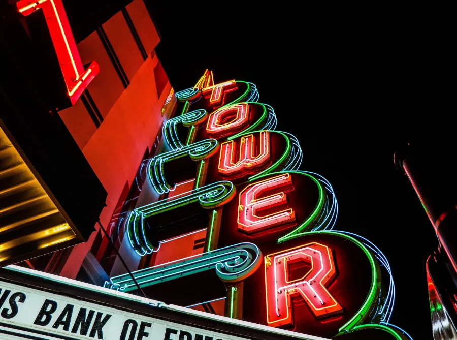 The vibrant red and green neon sign of the Tower Theatre shines as one of the things to do in Oklahoma City.