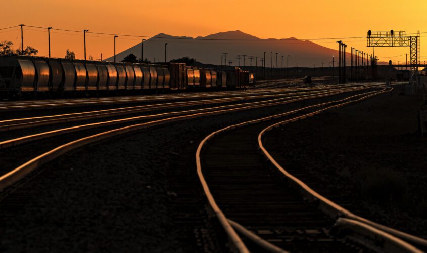 Train in a trainyard during a low sunset near our Winslow, Arizona lodging