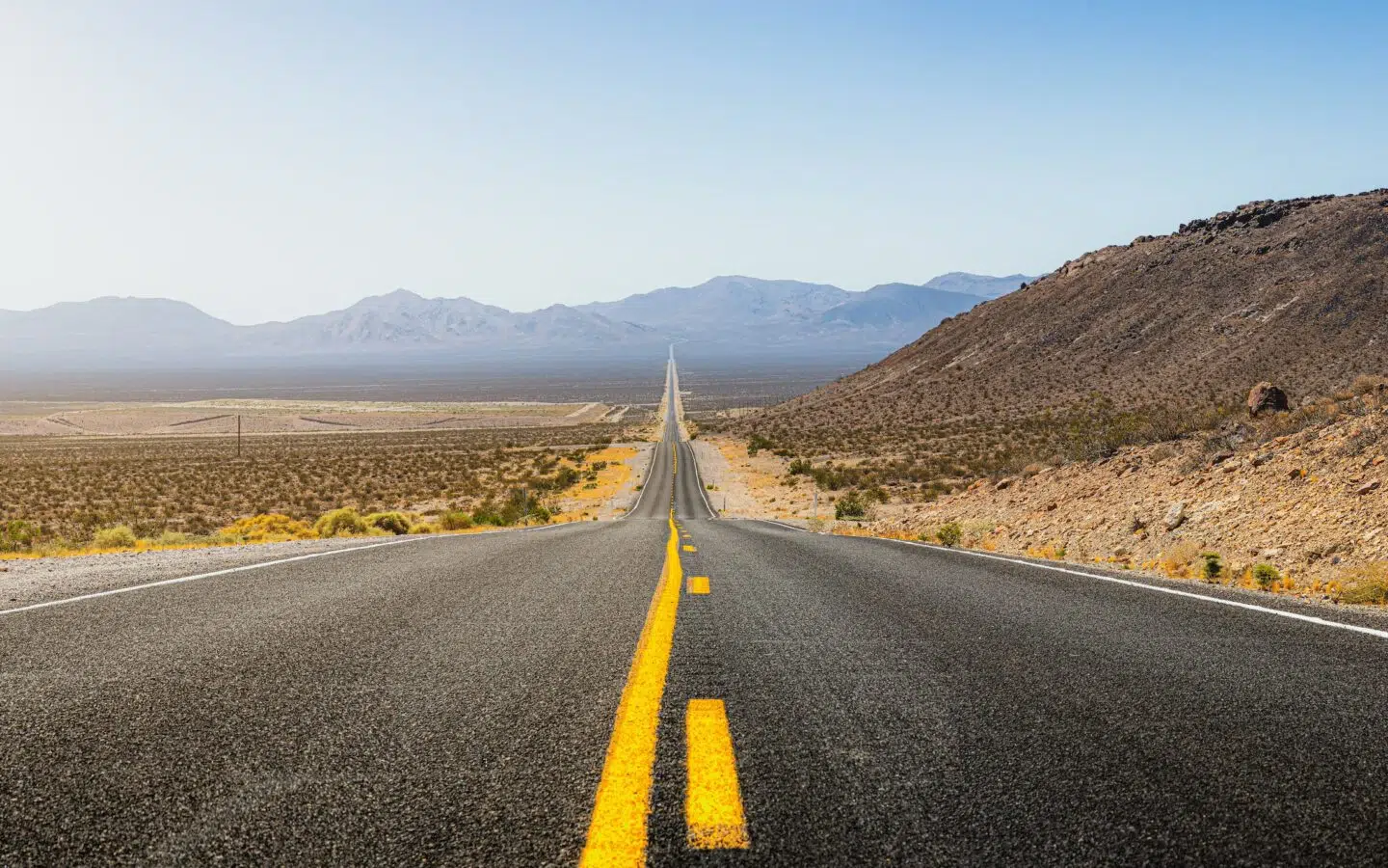 Endless road through desert landscape